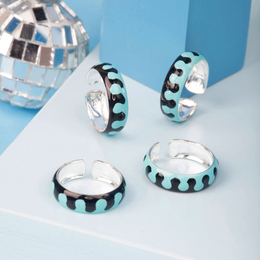 silver toe rings with white background