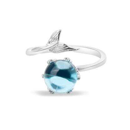 Silver ring with blue stone on white background