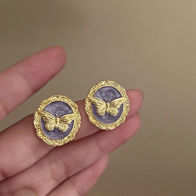 Gold butterfly oval stud earrings