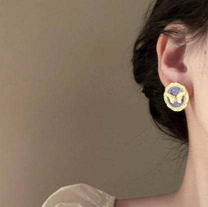 Gold butterfly oval stud earrings